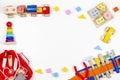 Baby kids toys background. Wooden educational toys, train, rainbow, airplane, blocks, construction tools and set of toy Royalty Free Stock Photo