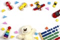 Baby kids toys frame on white background. Top view, flat lay. Copy space for text