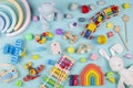 Baby kids toys pattern. Set of colorful educational wooden and fluffy toys on blue background. Top view, flat lay Royalty Free Stock Photo