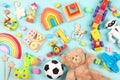 Baby kids toys pattern. Set of colorful educational wooden and fluffy toys for children on light blue background. Top Royalty Free Stock Photo