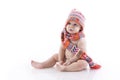 Baby in knitted hat and scarf