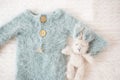 Baby knitted suit and bunny toy