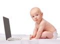 Baby, laptop and studio for entertainment, portrait and games in child development and progressive technology. Infant Royalty Free Stock Photo
