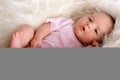 Baby laying in a sheepskin