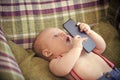 Baby learns technology. New technology, modern life Royalty Free Stock Photo