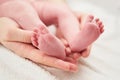 Baby legs foot in hands Royalty Free Stock Photo