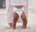 Baby legs, learning and walking with mother, support and first steps of healthy body development. Closeup mom teaching Royalty Free Stock Photo