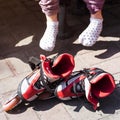 Active rest for children in the summer. Roller skating in the park Royalty Free Stock Photo