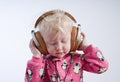 Baby listening music in headphones