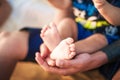 Baby little legs in the hands of the father. mindfull. Royalty Free Stock Photo