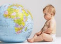 Baby Looking At Inflatable Globe Royalty Free Stock Photo