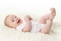 Baby lying on back smiling Royalty Free Stock Photo