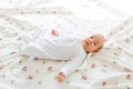 Baby lying in bed Royalty Free Stock Photo