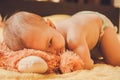 Baby lying on the bed and spies Royalty Free Stock Photo