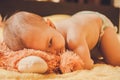 Baby lying on the bed and spies