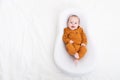 The baby is lying in a cocoon of copy space . The baby is 0-3 months old. A contented infant. An article about choosing Royalty Free Stock Photo