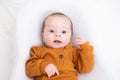 The baby is lying in a cocoon of copy space . The baby is 0-3 months old. A contented infant. An article about choosing Royalty Free Stock Photo