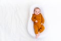 The baby is lying in a cocoon of copy space . The baby is 0-3 months old. A contented infant. An article about choosing Royalty Free Stock Photo