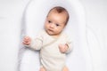 The baby is lying in a cocoon of copy space . The baby is 0-3 months old. A contented infant. An article about choosing Royalty Free Stock Photo