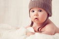 Baby lying on a soft bed cover Royalty Free Stock Photo