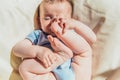 Baby lying in the sun angry and crying calling his parents Royalty Free Stock Photo