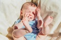 Baby lying in the sun angry and crying calling his parents Royalty Free Stock Photo