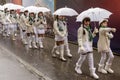 baby majorettes under umbrellas against rain at Carnival parade, Stuttgart