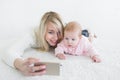 Baby make selfie on mobile phone Royalty Free Stock Photo