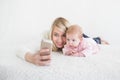 Baby make selfie on mobile phone Royalty Free Stock Photo