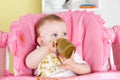 Baby making a mess while eating Royalty Free Stock Photo