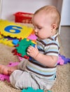 Baby making puzzle. Child jigsaw develops children.