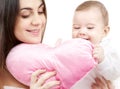 Baby and mama with heart-shaped pillow Royalty Free Stock Photo