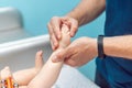 Baby massage closeup. Father and child. Newborn.