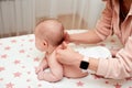 Baby massage. Mother massaging her newborn baby. Royalty Free Stock Photo