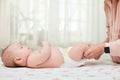 Baby massage. Mother massaging her newborn baby. Royalty Free Stock Photo