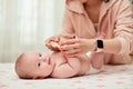 Baby massage. Mother massaging her newborn baby. Royalty Free Stock Photo