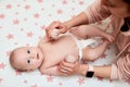 Baby massage. Mother massaging her newborn baby. Royalty Free Stock Photo