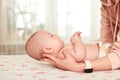 Baby massage. Mother massaging her newborn baby. Royalty Free Stock Photo