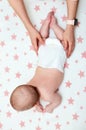 Baby massage. Mother massaging her newborn baby. Royalty Free Stock Photo