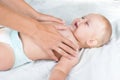 Baby massage. Mother massaging infant belly Royalty Free Stock Photo