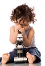 Baby with microscope. Royalty Free Stock Photo