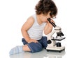 Baby with microscope. Royalty Free Stock Photo