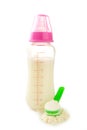 Baby milk bottle with powder isolated on white background Royalty Free Stock Photo