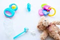 Baby milk powder, baby bottle and children`s toys on a light background flat lay Royalty Free Stock Photo