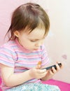 Baby with mobil telephone