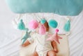 Baby mobile against blur of infant baby boy looking on the bed Royalty Free Stock Photo
