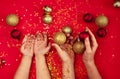 Baby and mom hands holding Christmas decorations. Royalty Free Stock Photo