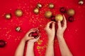 Baby and mom hands holding Christmas decorations. Royalty Free Stock Photo