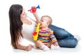 Baby and mom play musical toys Royalty Free Stock Photo