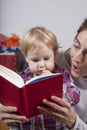 Baby and mom reading red book